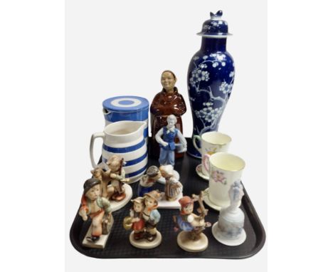 A group of West German Goebel figures, a Chinese blue and white lidded vase decorated with prunus, a Cornish ware lidded pot,