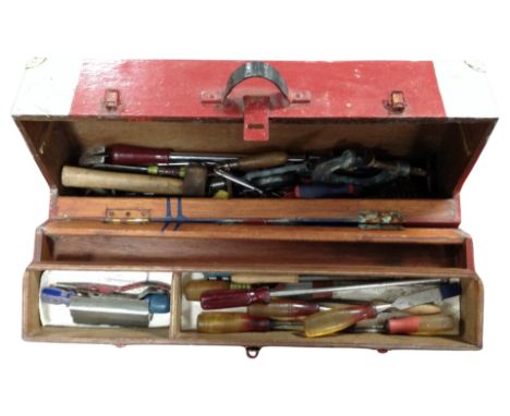 An antique joiner's tool box containing carpentry tools 