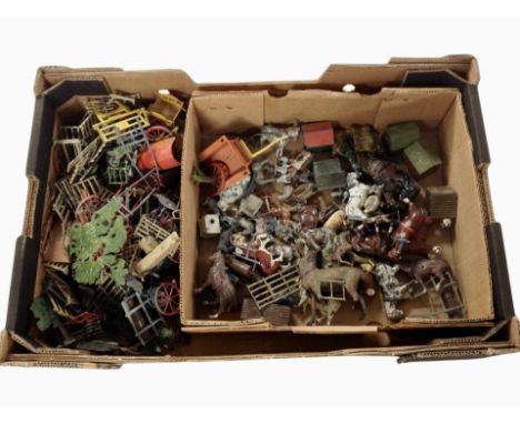A box of vintage painted diecast metal farm animals and structures, etc.