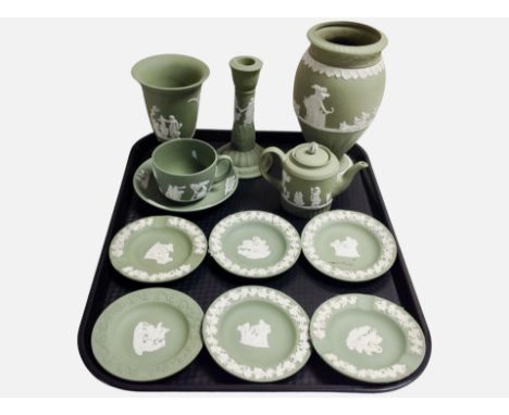 Twelve pieces of Wedgwood green Jasperware including pin dishes, vase, candlestick, etc.