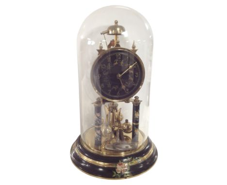 A brass mantel clock under glass dome with zodiac dial, height 31cm.