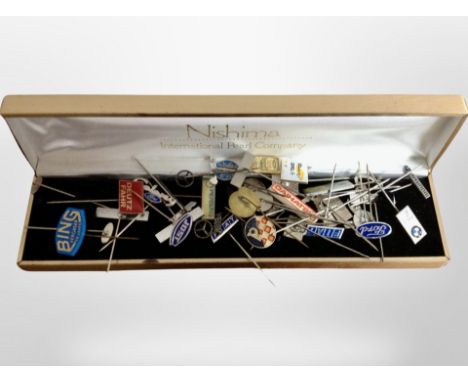 A group of automobile enameled pin badges.