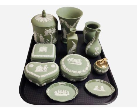 Eleven pieces of Wedgwood green Jasperware including trinket boxes, vase, table lighter, etc.