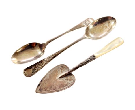 Two silver teaspoons and a silver trowel with mother of pearl handle.