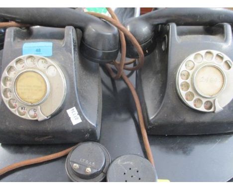A vintage 5955 black telephone and one other, together with two handset parts 