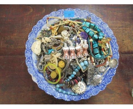 A selection of vintage jewellery on a Japanese charger 