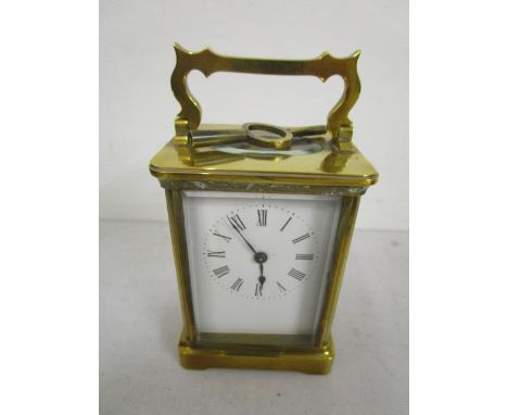 A brass cased five window carriage clock, with key, 5 1/2"h (including handle) 