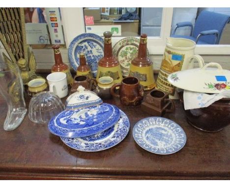 A collection of Bells Scotch whisky bottles, Cadburys mugs and other advertising ceramics, mixed ceramics and a brass fan fir