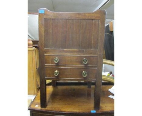 A Georgian mahogany commode having a tambour fronted sliding door and compartment below 