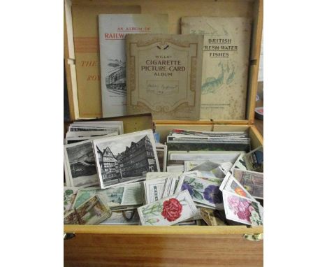 A quantity of vintage postcards to include Whitley Bay, cigarette cards to include Air Raid Precaution images and albums 