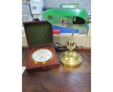 A brass and green glass desk lamp with a cased metotar 