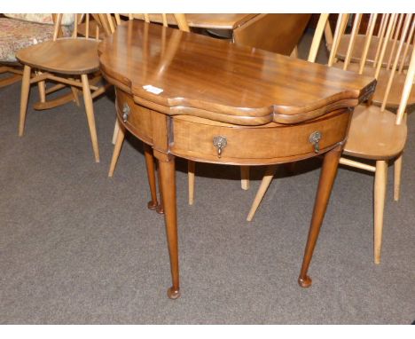 Mahogany shaped front fold top card table on pad feet