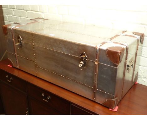 As new polished metal, leather and wood bound cabin trunk