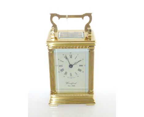 Period style brass carriage clock, signed Woodford, with key and card box