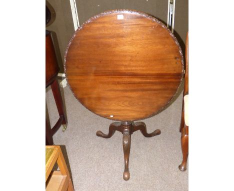 Chippendale style circular mahogany flip top occasional table on oak pedestal tripod base