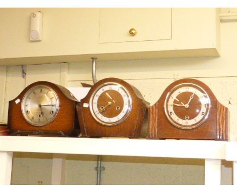 Three oak mantel clocks and modern barometer