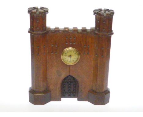 Oak mantel clock formed as a castle front
