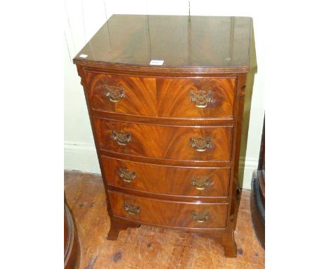 Neat mahogany bow front four drawer chest on splayed ogee bracket feet