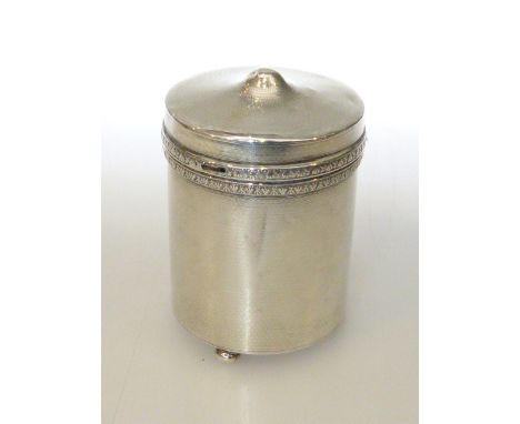 Silver engine turned cylindrical cigarette dispenser with spring loaded interior, London hallmarked and New Bond Street retai