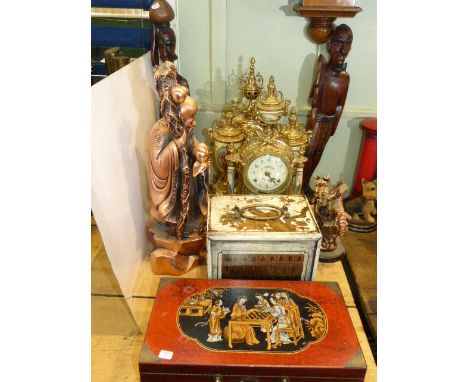 Ornate brass clock set, another brass clock, two Chinoiserie figures, two African carvings, Mahjong and chess sets