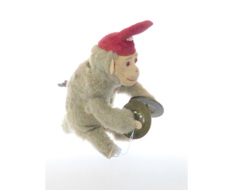 Vintage clockwork monkey playing cymbals