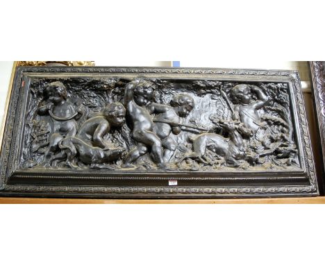 A 19th century carved and relief moulded composition panel depicting hunting scene with cherubs, 122x54cm