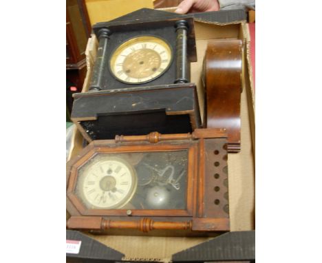 An Edwardian ebonised mantel clock; together with two further mantel clocks of the period (3)