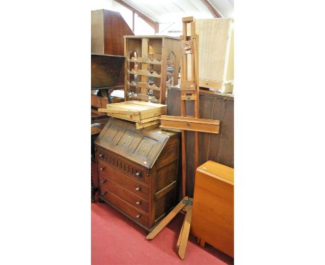 A teak freestanding artists easel; together with a further folding artists easel (2)