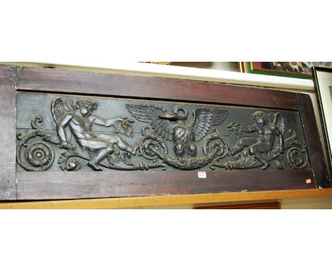 A carved and moulded composition relief panel in wooden frame, 130x43cm