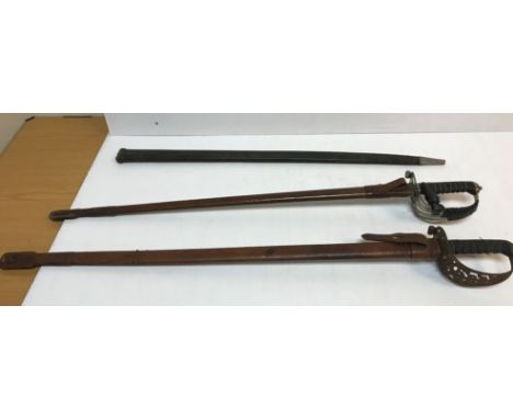 An Edward VII dress sword by Hawkes and Co in leather scabbard, another similar dress sword in leather scabbard both with wir