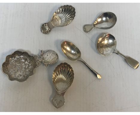 A George III silver caddy spoon of simple form (London, 1800 by Solomon Hougham) together with a mid 20th Century silver cadd