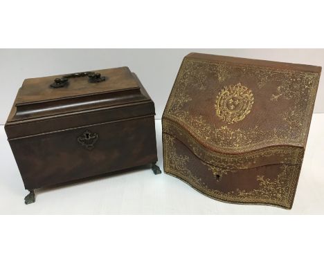 A George III mahogany tea caddy with brass swan neck handle, the top opening to reveal a three section interior (no lids) rai