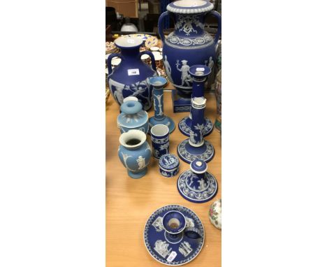 A collection of Wedgwood blue Jasperware including classical style vase on pedestal base to square foot 37 cm high, miniature