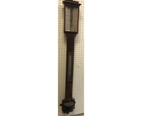 A Victorian oak cased stick barometer thermometer, the silvered rise/fall dial inscribed "Murray &amp; Heath 43 Piccadilly Lo