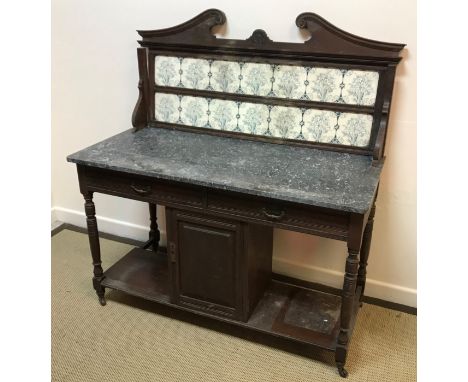 A Victorian mahogany chiffonier with concave drawer over two cupboard doors on a plinth base 110 cm wide x 46 cm deep x 96 cm