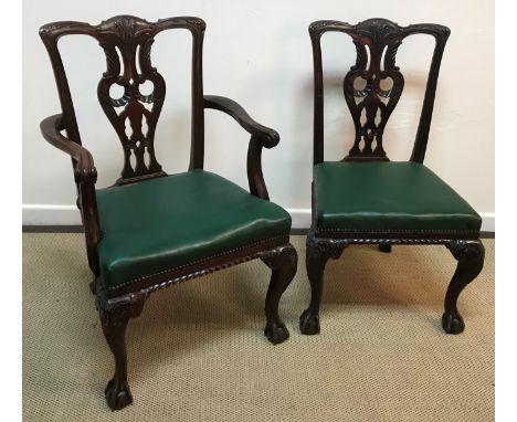 A set of eleven Victorian mahogany Chippendale style dining chairs, the carved back splat with scrolling acanthus decoration 