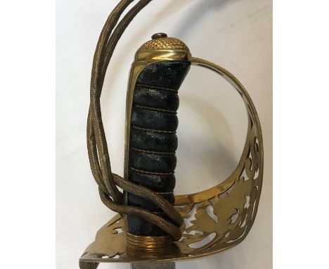 A Victorian engineer's dress sword by Wilkinson of London with gilt brass pierced knuckle guard and plain steel scabbard, the