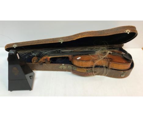 A late 19th Century Continental violin bearing "Guanarius" label dated 1697 (fake label) together with two violin bows and a 
