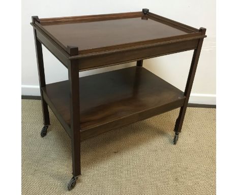 A 19th Century mahogany oval drop-leaf dining table on square tapered legs to castors, 106.5 cm wide x 159 cm long x 70 cm hi