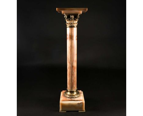 A late 19th century onyx and gilt metal mounted Corinthian column pedestal, on short gilt metal bracket feet, the square top 