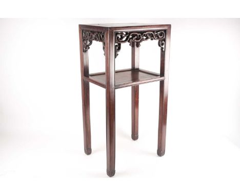 A Chinese hongmu official tea table, 19th century, the rectangular top above a pierced and carved stylised foliate frieze, on