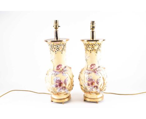 A pair of pottery table lamps, possibly Zsolnay/Fischer, Budapest, early 20th century, the neck pierced with rococo scrolls h