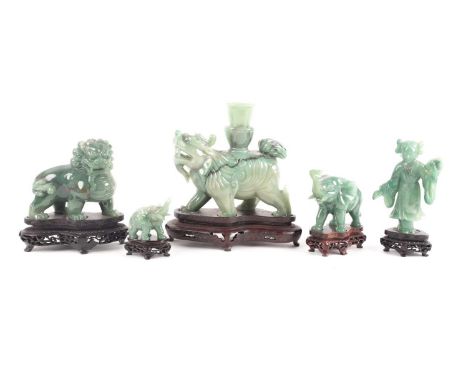 A group of five Chinese hardstone carvings, Peoples Republic period, comprising a Bixie candlestick, a temple lion, a young g