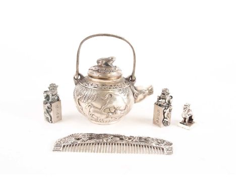 A Chinese white metal alloy teapot and cover. With buffalo decoration and spout and a toad mounted cover, with swing handle. 