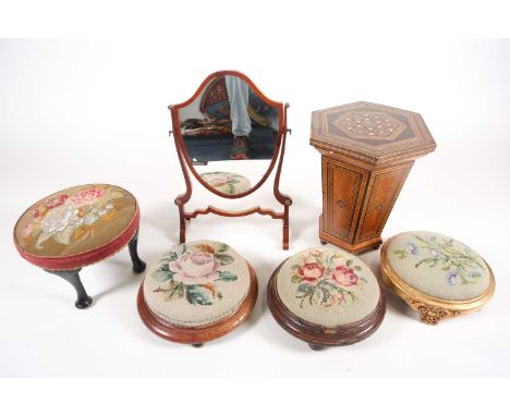 Four late 19th century tapestry top footstools, a shield shape toilet mirror and a Damascus ware inlaid trumpet form sewing b