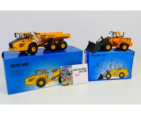 Scoop - Two boxed diecast 1:50 scale construction model vehicles from Scoop. Lot consists of Volvo BM L180C loader; with a Vo