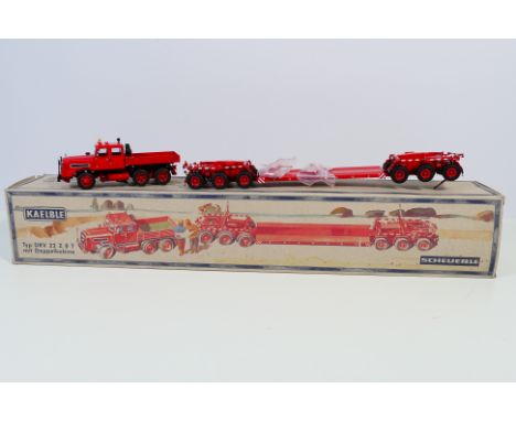 NZG - A boxed NZG #488 1:50 scale diecast Kaelble DKV 22 Z8T Truck and Scheuerle 6 Axle Trailer. The model in red appears to 