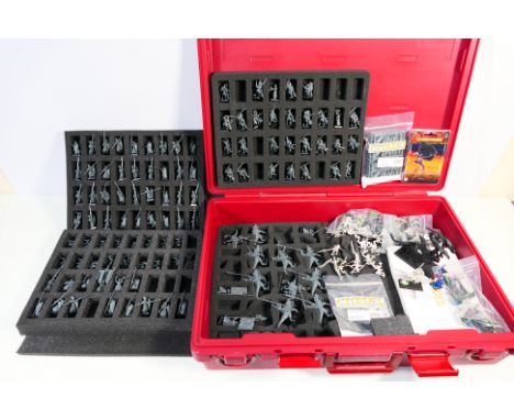 Warhammer - Games Workshop - Citadel - A maroon Games Workshop carry case containing several foam cases holding approximately