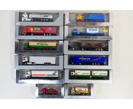Herpa - A collection of 12 boxed HO/1:87 scale plastic model trucks from Herpa's 'Exclusiv Serie'. Lot includes #814 Mercedes
