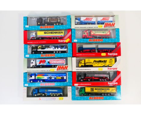 Herpa - Albedo - AMW - 12 boxed HO/1:87 scale plastic model trucks from Herpa. Lot includes Herpa #144254 Volvo FH16 Silo Tan